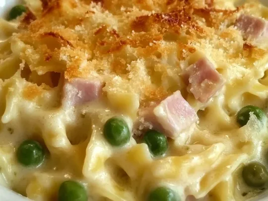 Tagliatelle besciamella, mozzarella, prosciutto e piselli